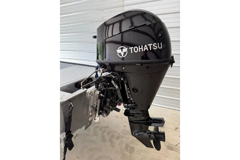 Slide: The Image of Tohatsu outboard motor on a 2026 Santee 160 Center Console boat. - 8