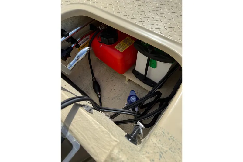 Slide: The Image of Storage compartment of 2026 Santee 160 Tiller Steer boat with fuel tank and battery. - 9