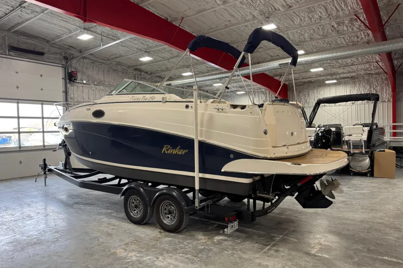 Slide: The Image of 2006 Rinker Fiesta Vee 250 boat on trailer in indoor storage facility. - 3