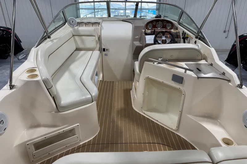 Slide: The Image of 2006 Rinker Fiesta Vee 250 boat interior with seating and steering console. - 6