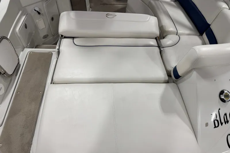 Slide: The Image of 2008 Crownline 300 LS boat interior with white cushioned seating and sleek design. - 10