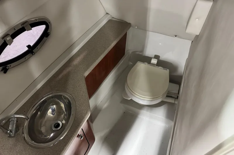 Slide: The Image of 2008 Crownline 300 LS boat bathroom with sink and toilet. - 12