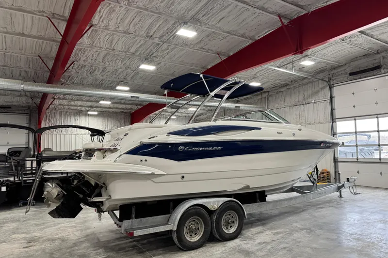 Slide: The Image of 2008 Crownline 300 LS boat on trailer in indoor storage facility. - 3