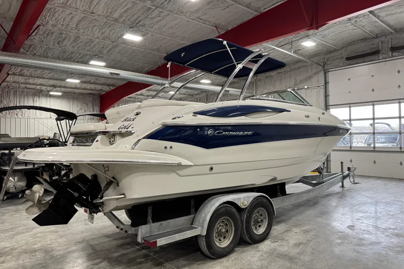 Slide: The Image of 2008 Crownline 300 LS boat on trailer in indoor storage facility. - 4