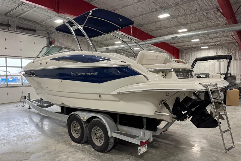 Slide: The Image of 2008 Crownline 300 LS boat on trailer in indoor storage facility. - 6