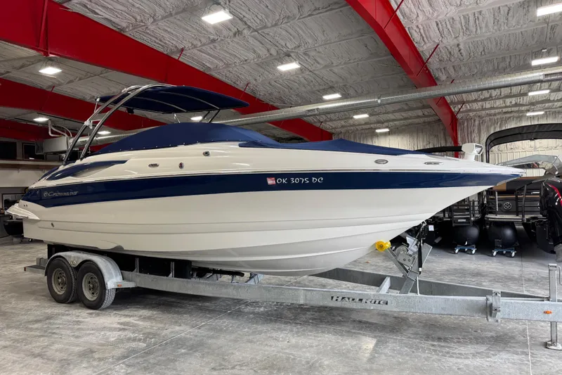 Slide: The Image of 2008 Crownline 300 LS boat on trailer in indoor storage facility. - 7