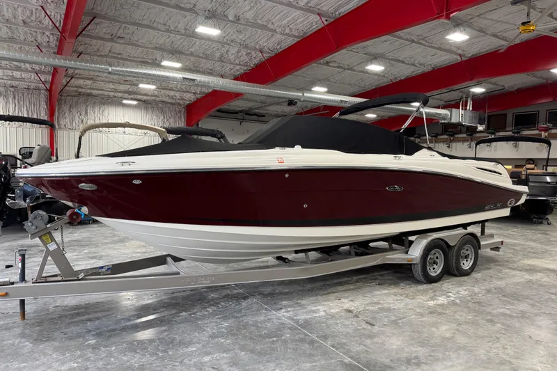 Slide: The Image of 2006 Sea Ray 270 SLX boat on trailer in indoor storage facility. - 11