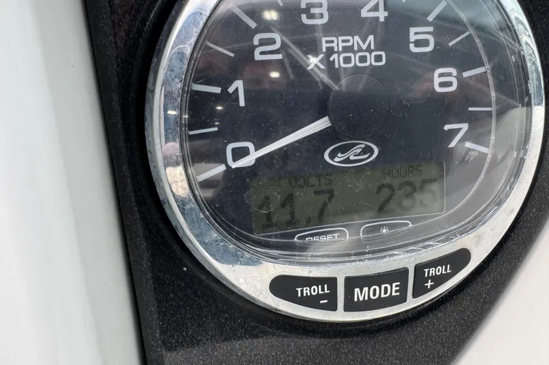 Slide: The Image of Close-up of a 2006 Sea Ray 270 SLX tachometer displaying RPM and engine hours. - 13