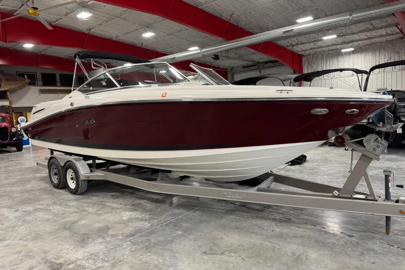 Slide: The Image of 2006 Sea Ray 270 SLX boat on trailer in indoor showroom. - 2