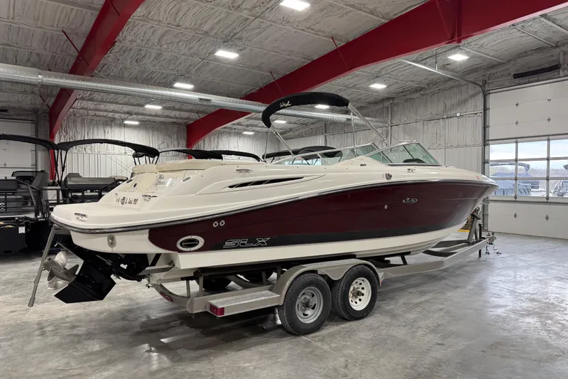 Slide: The Image of 2006 Sea Ray 270 SLX boat on trailer in indoor storage facility. - 4