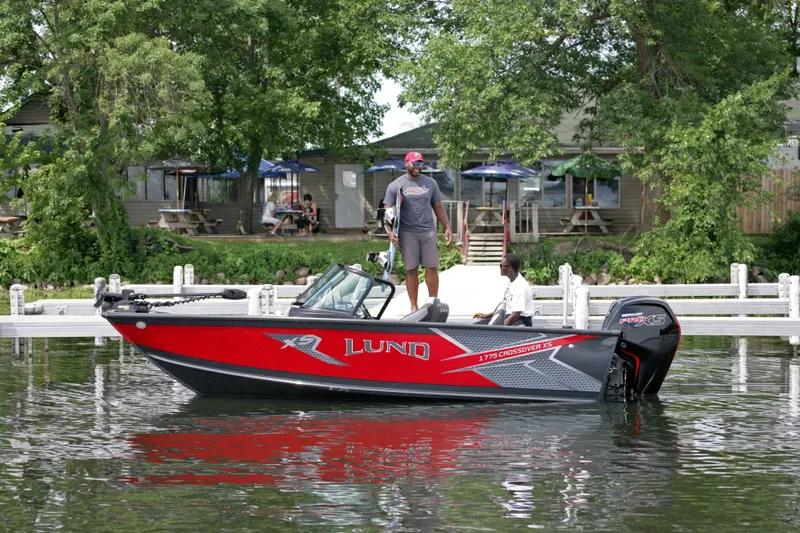 The Image of Lund 1875 Crossover XS boat on a lake, 2026 model. - 1
