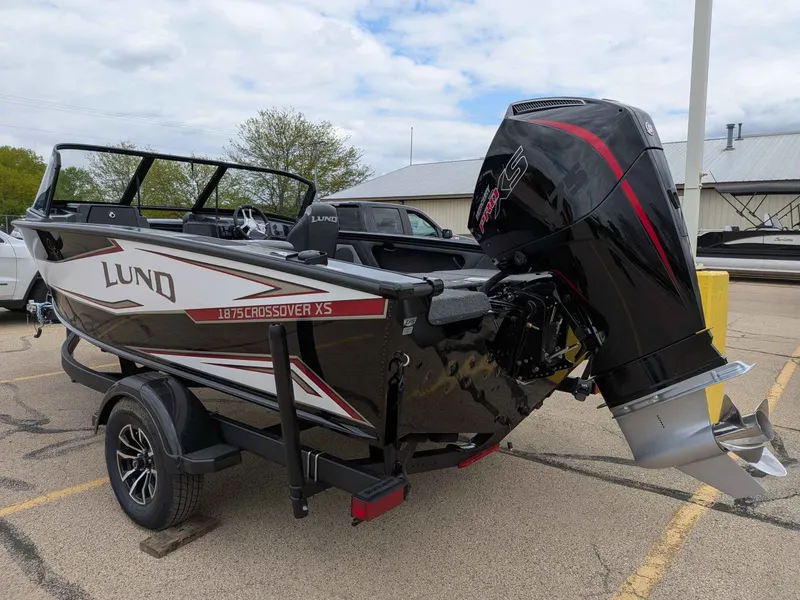Slide: The Image of 2026 Lund 1875 Crossover XS boat with outboard motor. - 3