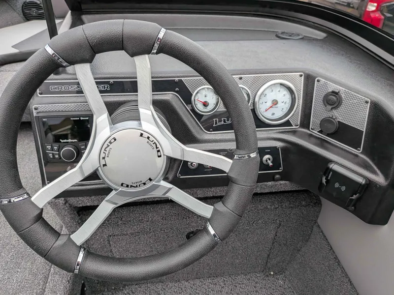 Slide: The Image of Interior view of 2026 Lund 1875 Crossover XS boat cockpit. - 8