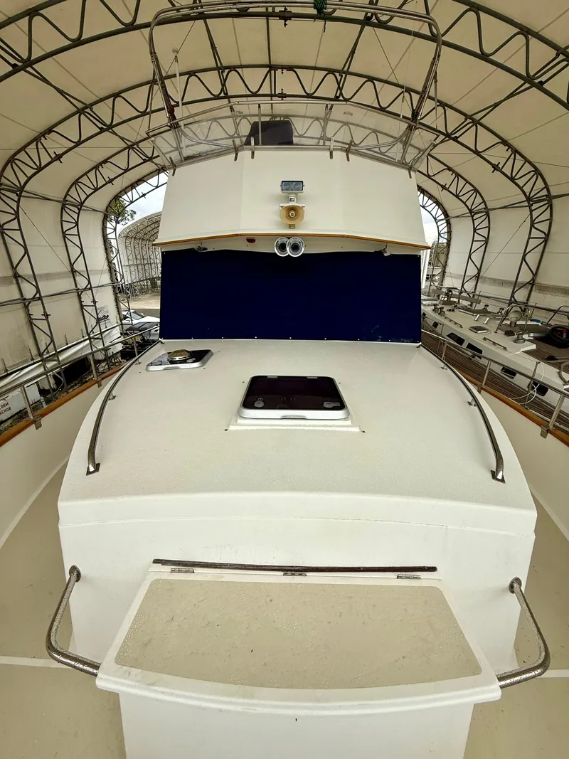 Slide: The Image of 1994 Grand Banks 49 Trawler in covered storage. - 14