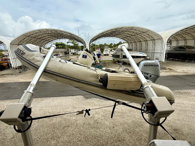 Slide: The Image of 1994 Grand Banks 49 Trawler with Honda motor at boat storage facility. - 7