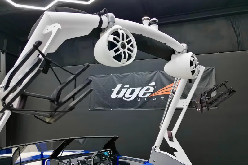 Slide: The Image of 2023 Axis A225 boat with wakeboard tower and speakers in showroom. - 11