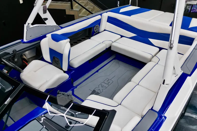 Slide: The Image of 2023 Axis A225 boat interior with blue and white seating, modern design. - 6