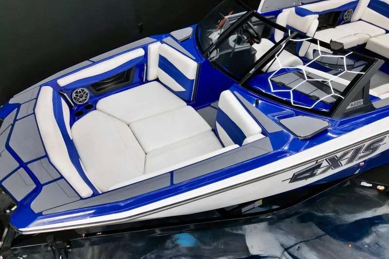 Slide: The Image of 2023 Axis A225 boat interior with blue and white seating, sleek design, and modern features. - 7