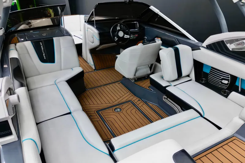 Slide: The Image of Interior of 2014 Nautique Super Air Nautique G21 boat with luxurious seating and wood flooring. - 3
