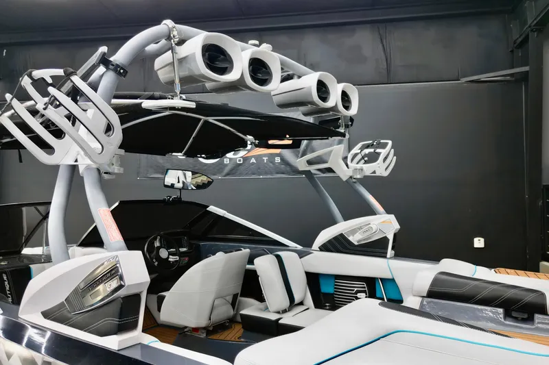 Slide: The Image of 2014 Nautique Super Air Nautique G21 interior with advanced sound system and sleek design. - 7