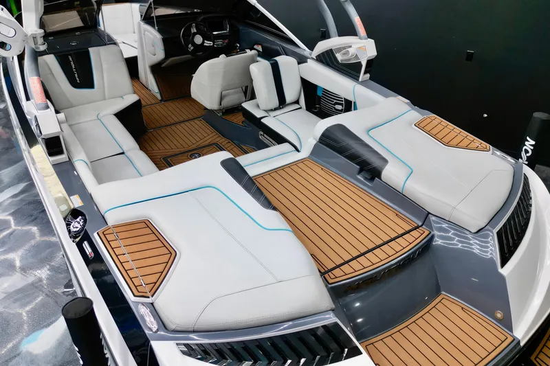 Slide: The Image of Luxurious interior of 2014 Nautique Super Air Nautique G21 boat with sleek seating and wood accents. - 9