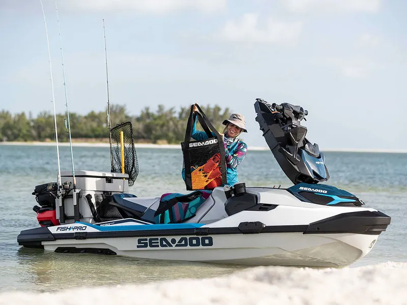 Slide: The Image of 2024 Sea-Doo FishPro Sport 170 on beach with angler. - 12