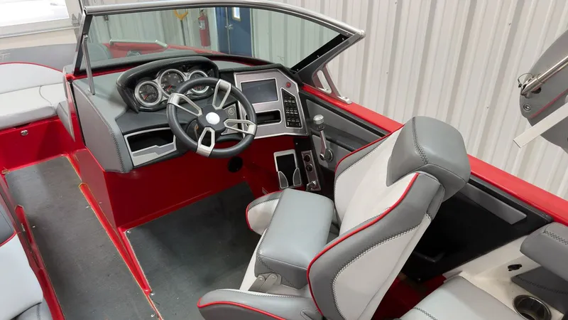 Slide: The Image of Interior of a 2019 MasterCraft XT20 boat with gray and red accents. - 12