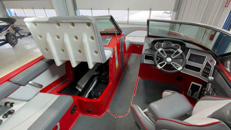 Slide: The Image of Interior of a 2019 MasterCraft XT20 boat with red design. - 14