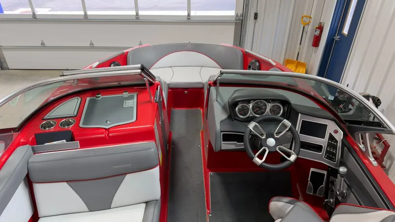 Slide: The Image of Interior of a 2019 MasterCraft XT20 boat, red and gray upholstery. - 15