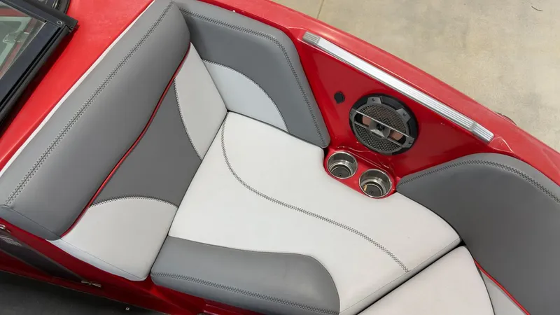 Slide: The Image of Interior of a 2019 MasterCraft XT20 boat with gray and red seating. - 18