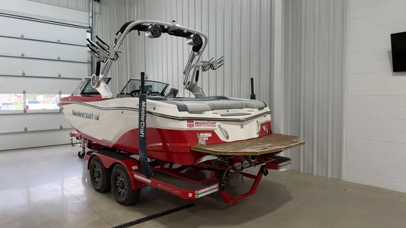 Slide: The Image of 2019 MasterCraft XT20 boat parked in a garage. - 3