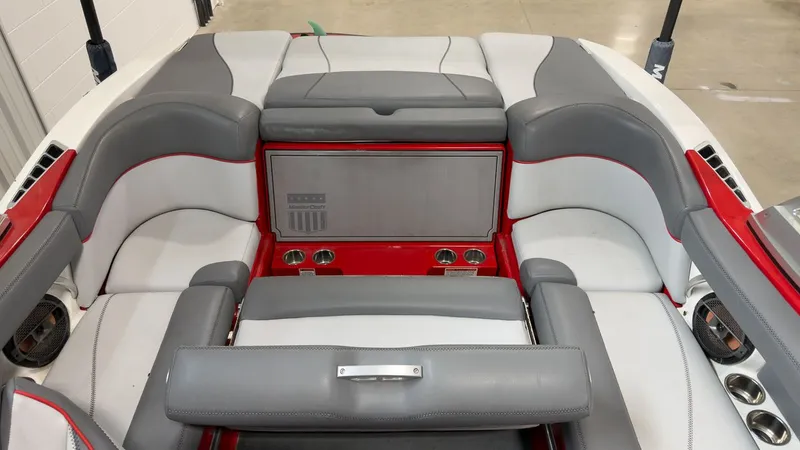 Slide: The Image of Interior of a 2019 MasterCraft XT20 boat with gray and red seating. - 6