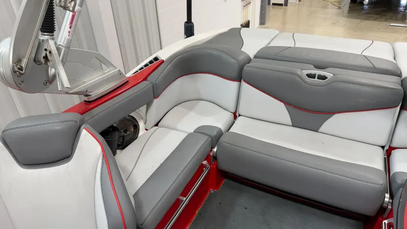 Slide: The Image of Interior of a 2019 MasterCraft XT20 boat with gray and red seating. - 7