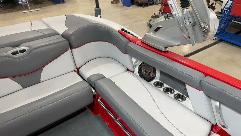 Slide: The Image of Interior of a 2019 MasterCraft XT20 boat with gray and red accents. - 8