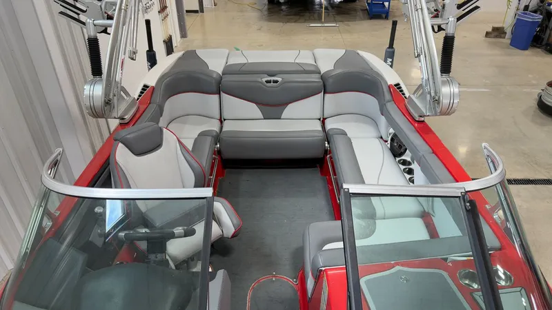 Slide: The Image of Interior of a 2019 MasterCraft XT20 boat, red and gray upholstery. - 9