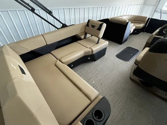 Slide: The Image of Interior of Evotti 523CS boat, 2026, featuring beige leather seating. - 13