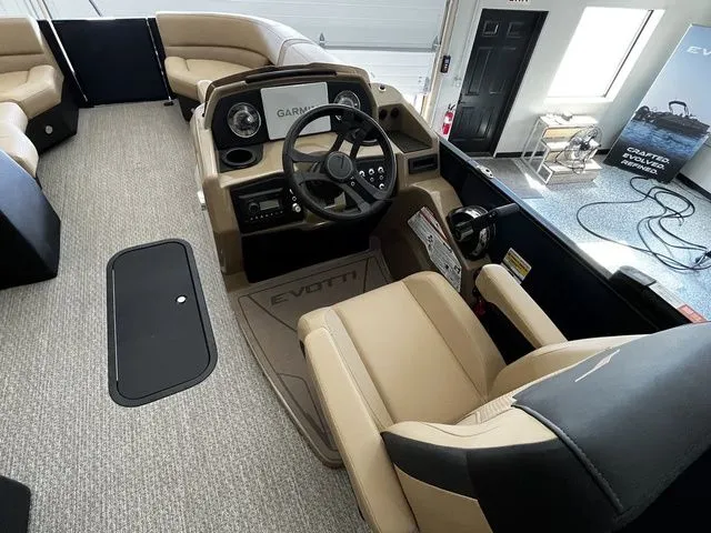 Slide: The Image of Interior of 2026 Evotti 523CS boat featuring modern helm console. - 14