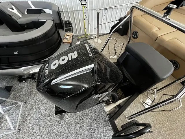 Slide: The Image of Evotti 523CS 2026 with Mercury outboard motor in a boat workshop. - 6