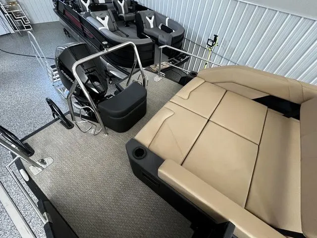Slide: The Image of Interior of a 2026 Evotti 523CS boat with beige and gray seating. - 8