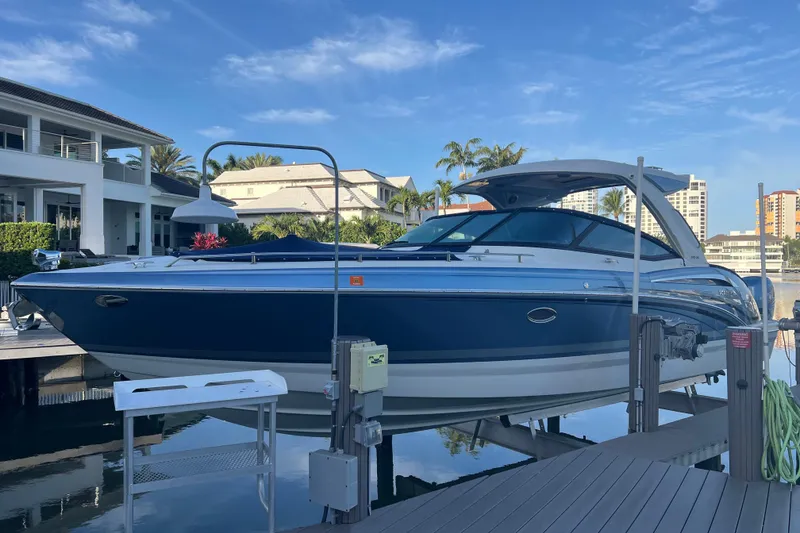The Image of 2019 Formula 350 Crossover Bowrider I/O docked, showcasing sleek design and luxury features. - 0