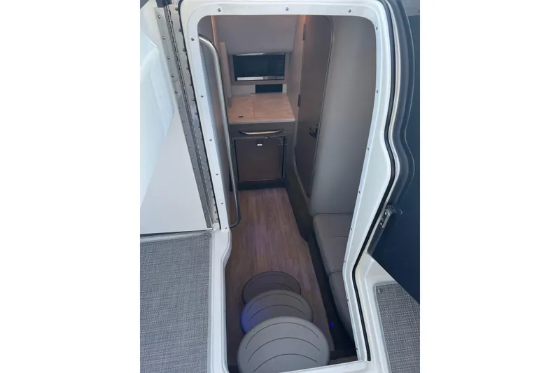 Slide: The Image of Interior cabin of 2019 Formula 350 Crossover Bowrider I/O, featuring compact design and modern amenities. - 18