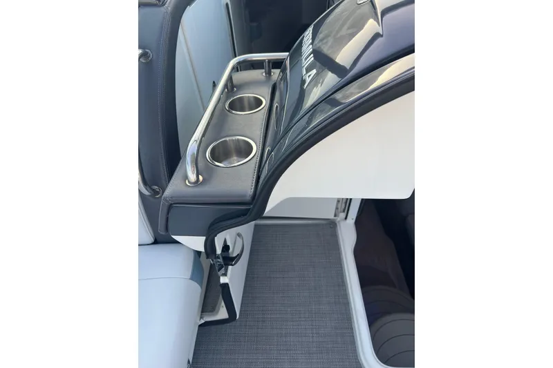 Slide: The Image of 2019 Formula 350 Crossover Bowrider I/O interior with cup holders and sleek design. - 19