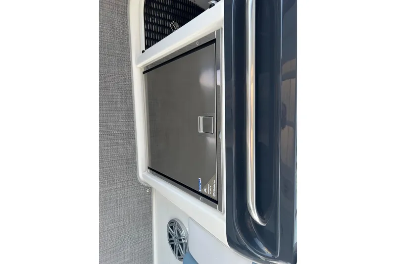 Slide: The Image of 2019 Formula 350 Crossover Bowrider I/O interior with stainless steel fridge and speaker. - 21