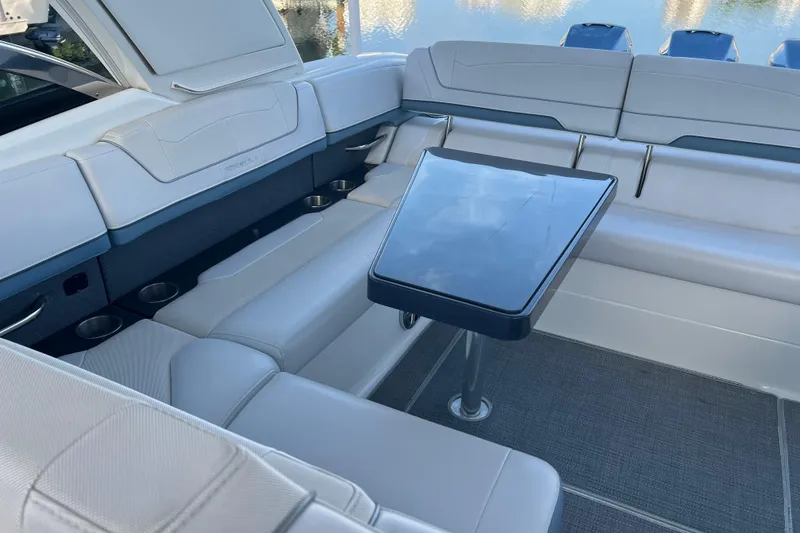 Slide: The Image of 2019 Formula 350 Crossover Bowrider I/O interior with seating and table. - 24