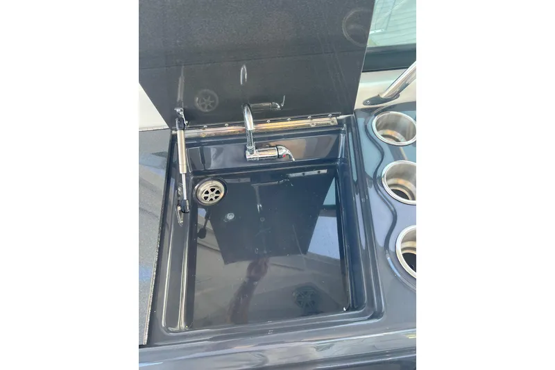 Slide: The Image of 2019 Formula 350 Crossover Bowrider I/O sink and cup holders detail. - 26