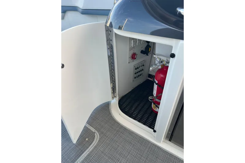 Slide: The Image of 2019 Formula 350 Crossover Bowrider I/O interior storage with fire extinguisher and control panel. - 28