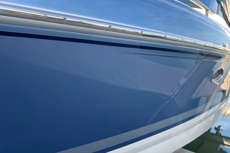 Slide: The Image of 2019 Formula 350 Crossover Bowrider I/O, sleek blue hull detail. - 3