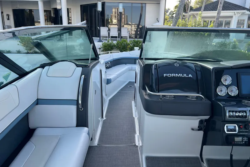 Slide: The Image of 2019 Formula 350 Crossover Bowrider I/O interior with sleek seating and modern dashboard. - 30