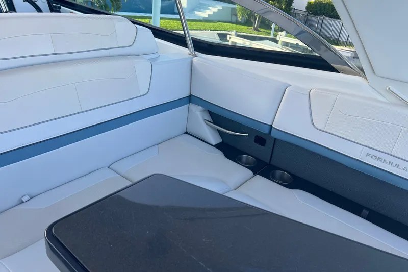 Slide: The Image of 2019 Formula 350 Crossover Bowrider I/O interior with white seating and sleek design. - 31