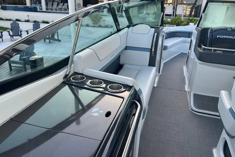 Slide: The Image of 2019 Formula 350 Crossover Bowrider I/O interior with sleek seating and cup holders. - 33